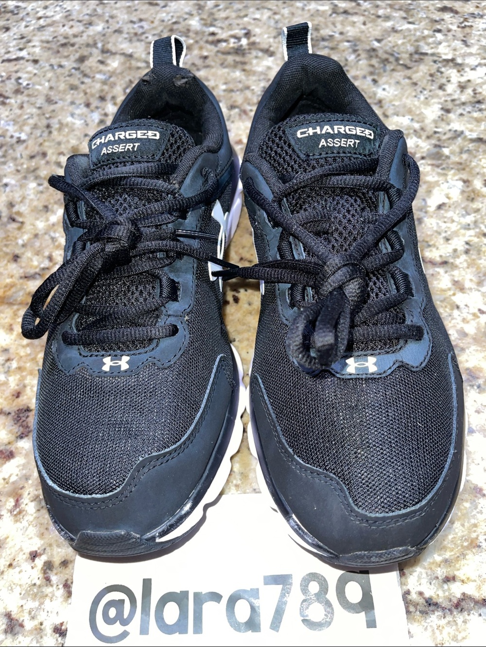 Under Armour Charged Assert 9 in Black and White